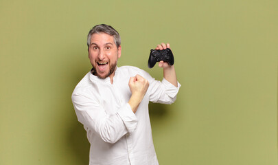 middle age man gamer with a remote control © kues1