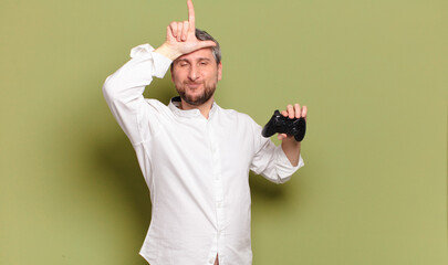 middle age man gamer with a remote control © kues1