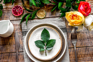 ceramic tableware top view on wooden background mock up