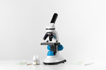 White microscope on the table, scientific laboratory.
