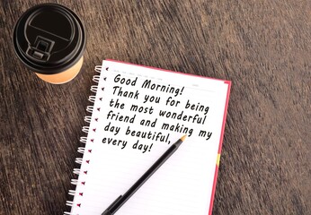 Text on notepad with background of cup of coffee and a pen