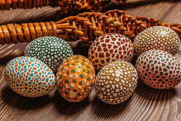 Happy Easter.Colorful hand painted decorated Easter eggs, willow branches. Handmade Easter eggs on wooden table.Spring decoration background. Festive tradition for Eastern European countries.DIY Craft
