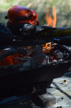 Flames In Hibachi Grill Roasting Red Bell Pepper