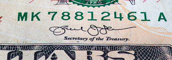 Fragment of ten American dollars banknote close-up.