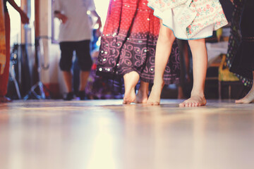 legs of barefoot dancers. traditional Italian dance