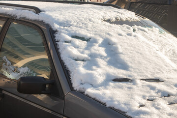 Many cars in the snow in the parking in winter