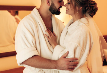 
lovers in the bedroom in bathrobes