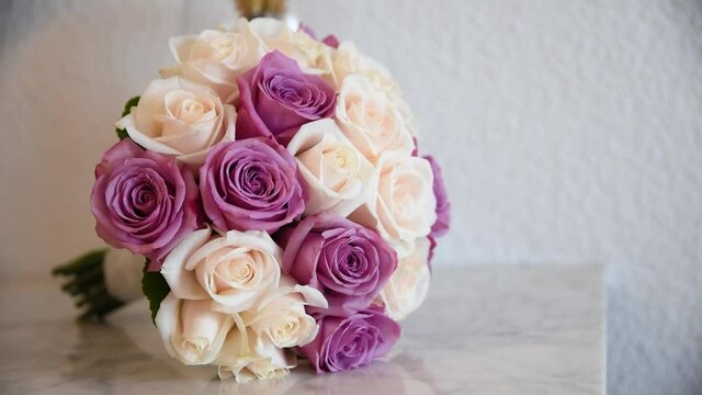 Nice bouquet of flowers for the bride. A bouquet of white and pink cor roses. Accessories for the bride on her wedding day