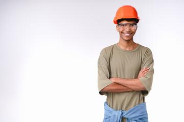 Confident young construction worker in hard hat isolated over white background