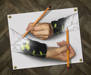 Two impossible women's hands with pencils draw each other. Wooden background.