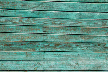 Chipped together boards covered with green paint.