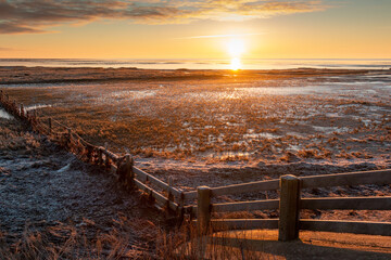 Sunrise over the Wadden Sea, a start of a beautiful winter day