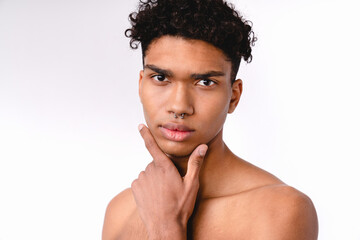Attractive young mixed-race man without clothes isolated over white background