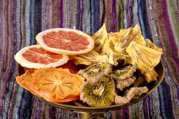 Close-up of dried tropical fruits with colorful background. Healthy natural flavor snacks:...