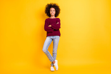 Fototapeta na wymiar Full size portrait of adorable dark skin pupil folded hands toothy smile wear pullover isolated on yellow color background