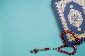 Ramadan Kareem, Eid Mubarak or Islamic concept. The Islamic holy book, Quran or Kuran, with rosary...