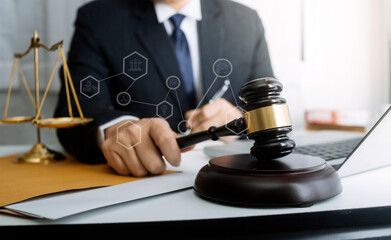 Business and lawyers discussing contract papers with brass scale on desk in office. Law, legal...