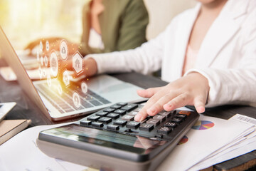 Business woman working teamwork process, Business team using a calculator to calculate the numbers of statistic business profits growth rate Technology and icon data customer global network connection