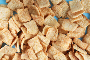 Background group of cinnamon sugar cereal for breakfast close up.