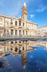 Fototapeta premium Rome, Italy - in Winter time, frequent rain showers create pools in which the wonderful Old Town of Rome reflects like in a mirror. Here in particular Santa Maria Maggiore