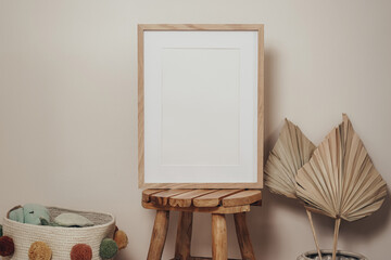 Wooden frames and canvases in children's boho interior 