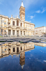 
Rome, Italy - in Winter time, frequent rain showers create pools in which the wonderful Old Town of Rome reflects like in a mirror. Here in particular Santa Maria Maggiore