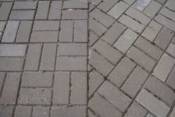 Rectangular paving slabs lying at different angles.