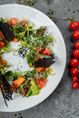 salad with pumpkin tomatoes and fried liver. Halloween Salad