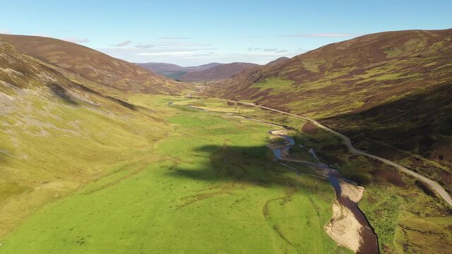 Flying along the river at the beautiful Spittal of Glenshee - The Highlands of Scotland from above - 4K Drone Movie