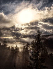 Dramatic Scenic Nature View of Canadian Mountain Landscape covered in clouds. Artistic Render. Located near Squamish and Whistler, British Columbia, Canada.