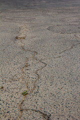 Hot, cracked asphalt on the road.