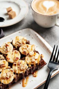 large waffles with filling on a gray background with coffee