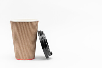 one cardboard cup for coffee and lid on a white background
