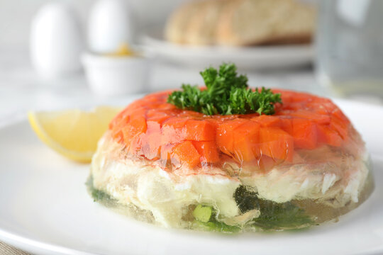 Delicious fish aspic with parsley on plate, closeup