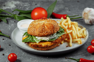 Fresh and fried fish burger with vegetables