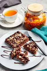 large waffles with filling on a gray background with coffee