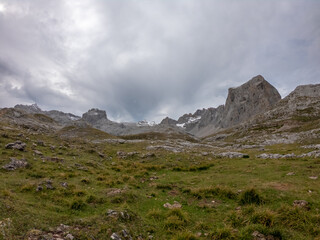 The upper start section of hiking track PR-PNP 24 to the magnificient summits of Mounts Pena Remona, Torre de Salinas, La Padierna and Pico de San Carlos at Picos de Europa National Park, Spain.