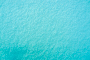 Fototapeta na wymiar Colored snow as a background. Turquoise background.