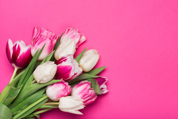 Bouquet of tulips in pink and white colors. Concept of spring, Women's Day, Mother's Day, 8 March, the holiday greetings. Copy space, flat lay.