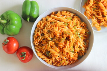 Red sauce pasta with bell peppers. Homemade Fusilli Pasta with Arrabbiata sauce