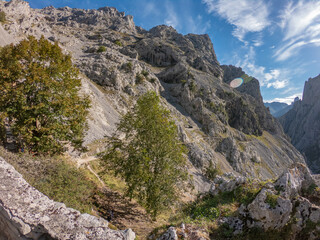 The Cares Route in the heart of Picos de Europa National Park, Cain-Poncebos, Asturias, Spain. Narrow and impressive canyon between cliffs, bridges, caves, footpaths and rocky mountains.