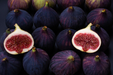 Tasty figs on a black background. Top view.