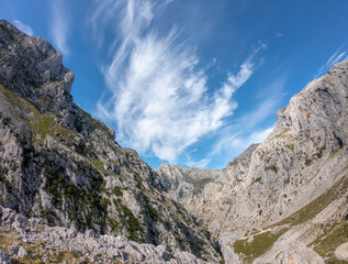 The Cares Route in the heart of Picos de Europa National Park, Cain-Poncebos, Asturias, Spain. Narrow and impressive canyon between cliffs, bridges, caves, footpaths and rocky mountains.