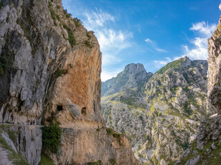 The Cares Route in the heart of Picos de Europa National Park, Cain-Poncebos, Asturias, Spain. Narrow and impressive canyon between cliffs, bridges, caves, footpaths and rocky mountains.