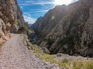 The Cares Route in the heart of Picos de Europa National Park, Cain-Poncebos, Asturias, Spain. Narrow and impressive canyon between cliffs, bridges, caves, footpaths and rocky mountains.