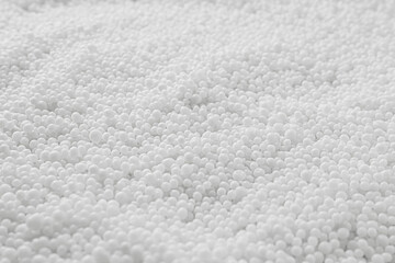 Pellets of ammonium nitrate as background, closeup. Mineral fertilizer