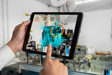 Engineer use augmented reality software in smart factory production line with automated application...