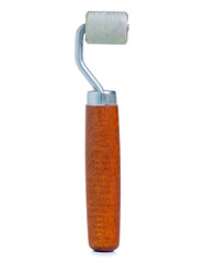 hand tool steel roller for laying soundproofing on white background isolation