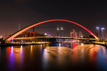 Fototapeta na wymiar Tolerance Bridge Dubai at night. Famous tourist attraction place to visit in holidays. Modern architecture design.