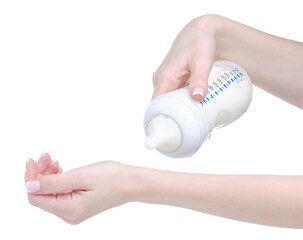 Baby bottle with milk in hand on white background isolation